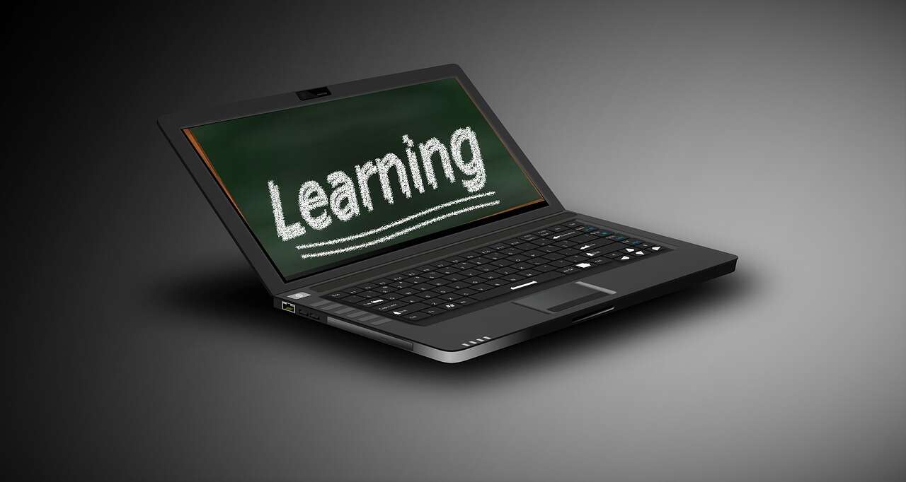 Laptop with "Learning" on the screen